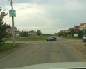Разбит участок дороги на възде в п. Просторный, г. Томска