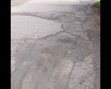 Разбитый асфальт, не видевший ремонта более 5 лет.