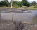 Огромная яма с не просыхающей лужей.