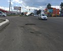 Огромные ямы на дороге около торгового центра Макси по ул. Шилова