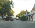 Продавлен асфальт и ливневая решетка.