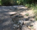 Многие годы состояние дороги ужасающее. Очень много глубоких ям. На машине можно проехать с трудом, в следствии этого такси ехать отказывается, мамам с колясками просто не осилить прогулку с детьми, старики бояться вызывать Скорую Помощь, зная что она не доедет! Пишем и просим починить участок дороги каждый год. В этом году на ремонт выделены средства и ремонт начался (номера домов 1-61). НО! Минуя наш участок дороги (номера домов 74-84), который в более ужасном состоянии.