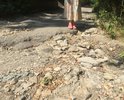 Многие годы состояние дороги ужасающее. Очень много глубоких ям. На машине можно проехать с трудом, в следствии этого такси ехать отказывается, мамам с колясками просто не осилить прогулку с детьми, старики бояться вызывать Скорую Помощь, зная что она не доедет! Пишем и просим починить участок дороги каждый год. В этом году на ремонт выделены средства и ремонт начался (номера домов 1-61). НО! Минуя наш участок дороги (номера домов 74-84), который в более ужасном состоянии.
