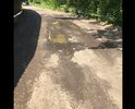 Убита дорога , недавно был выполнен "ямочный ремонт" для галочки (с наглядными нарушениями ), но на дороге как были ямы так и остались. Помимо этого дорогу регулярно затапливает после дождей , что наглядно видно на фото. Дорога находиться на улице Светлая в селе Ромашково, просьба полностью поменять покрытие асфальта на данном участке дороги.