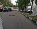 Данные ямы находятся на парковке возле магазина, глубина ям просто кошмар, рядом много жилых домов, там не то что на машине, там пешком пройти сложно. Просьба решить проблему.