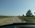 Дорога в неудовлетворительном состоянии после проведения некачественного ямочного ремонта.