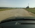 Дорога в неудовлетворительном состоянии после проведения некачественного ямочного ремонта.