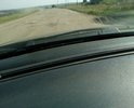 Дорога в неудовлетворительном состоянии после проведения некачественного ямочного ремонта.