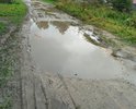Дорога по адресу Архангельская обл., г.Каргополь, ул.Шенкурская просто в ужасном состоянии. Ее не ремонтировали более 30 лет. Дорога не пригодна как для проезда на машинах так и пройти пешеходам. В конце улицы находится родник. Людям тяжело ходить за водой. На этой улице живут пенсионеры, вскоре и скорая помощь не сможет проехать и оказать первую помощь. Данная дорога требует капитального ремонта. Просим обратить внимания на данную ситуацию.