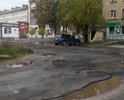 Проезд с ул. 30 лет Октября во двор дом №10 в очень плохом состоянии очень давно. На жалобы в ГИБДД только засыпали ямы щебнем.