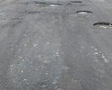 Дорога перестала соответствовать всем стандартам и требованиям качества. Это асфальтовое покрытие, которое совершенно не ремонтировали в следствии чего оно пришло не в годность. Данная дорога связывает посёлки с основным городом, в котором есть больница. Так же по данной дороге каждый день проходит маршрут школьного автобуса. Скоро наступить зима, дорога будет скользкой и аварий будет просто не избежать. Люди просто будут изолированы от города, в котором находятся все службы (скорая, пожарная, полиция, соц. защита и др.)