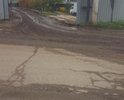Первоначально администрация обещала отремонтировать данную дорогу до 1 августа 2017 года. До сих пор даже минимального ямочного ремонта не произведено. Более того, на этой дороге расположены промышленные предприятия (почему-то на землях сельхозназначения,и грузовые автомобили которые следуют с этих или на эти предприятия окончательно добивают эту дорогу. К тому же на территории этих предприятий нет твердого покрытия и дорога постоянно грязная. В ответ на обращение на портале "Добродел", пришел ответ, что дорога стоит в очереди на ремонт в 2018 году. Хорошо, а до этого времени что делать?!  Уже не осталось такой траектории, включая обочины, чтоб можно было проехать и не попасть в одну из ям (до 20 см глубиной, кстати). Убедительно прошу принять меры. Спасибо