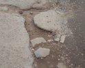 Первоначально администрация обещала отремонтировать данную дорогу до 1 августа 2017 года. До сих пор даже минимального ямочного ремонта не произведено. Более того, на этой дороге расположены промышленные предприятия (почему-то на землях сельхозназначения,и грузовые автомобили которые следуют с этих или на эти предприятия окончательно добивают эту дорогу. К тому же на территории этих предприятий нет твердого покрытия и дорога постоянно грязная. В ответ на обращение на портале "Добродел", пришел ответ, что дорога стоит в очереди на ремонт в 2018 году. Хорошо, а до этого времени что делать?!  Уже не осталось такой траектории, включая обочины, чтоб можно было проехать и не попасть в одну из ям (до 20 см глубиной, кстати). Убедительно прошу принять меры. Спасибо