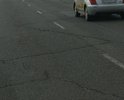 Дорога в латках и трещинах