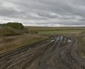 Дорога находится в неудовлетворительном состоянии, асфальтовое покрытие нарушено, разбито, ямы, колеи, выбоины, в дождливую погоду образуются промоины, лужи, затруднено движение пешеходов и автотранспорта (в том числе транспорта специального назначения, скорая, аварийные службы)