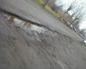 Огромные ямы во дворе у дома и к подъезду к почте Россия