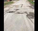 Разбитый участок дороги