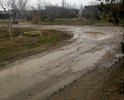 Пгт Приморский по адресу ул.  Десантников дома 7 и 9. При подъезде к данным домам со стороны завода "МОРЕ" дороги нет вообще, там всегда грязь и огромные лужи. К дому по адресу Десантников 7 подойти вообще не возможно, жителям приходиться идти через двор дома № 9. Данная проблема по этим адресам актуальна уже очень много лет и решить ее никак не могут. Одно время пытались что-то сделать и насыпали щебенки, но это все ненадолго, хватило буквально на полгода. Огромные ямы на дороге, машины днищем цепляют дорогу.  Пожалуйста, решите данную проблему. После дождя, еще на протяжении нескольких дней стоит грязь и лужи.