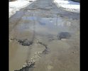 Этот участок дороги ведет к "жемчужине" нашего города - пляжу городского озера. Так вот, пока к нему (пляжу) идешь все ноги переломаешь да и толком не проедешь.
Многочисленные глубокие ямы, от асфальта остались лишь небольшие напоминания, что он там был когда то.
Мы жильцы прилегающих улиц пытались как то восстановить дорожное покрытие (засыпали ямы щебенкой купленной за свои же кровные) но хватило лишь на короткое время, по весне Щебенку вымыло из ям.