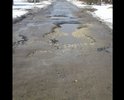 Этот участок дороги ведет к "жемчужине" нашего города - пляжу городского озера. Так вот, пока к нему (пляжу) идешь все ноги переломаешь да и толком не проедешь.
Многочисленные глубокие ямы, от асфальта остались лишь небольшие напоминания, что он там был когда то.
Мы жильцы прилегающих улиц пытались как то восстановить дорожное покрытие (засыпали ямы щебенкой купленной за свои же кровные) но хватило лишь на короткое время, по весне Щебенку вымыло из ям.