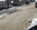 Отсутствие асфальтного покрытия после коммунальных работ много ям в некоторых местах просадка асфальта