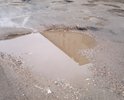Этот участок не ремонтировался со времени постройки этой автодороги. два раза в год грейдером подравнивают, но это не решает проблему, через неделю все ямы вновь появляются на своих местах. Ямы глубиной более 15 см.