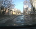 Мелкие ямы на протяжении всей улицы