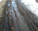 Каша грязи весной, осенью, летом после дождя не возможно проехать на легковом транспорте, доехать домой, выехать на работу, в школу. Асфальта нет вообще. Просим проложить асфальт.