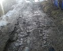 Каша грязи весной, осенью, летом после дождя не возможно проехать на легковом транспорте, доехать домой, выехать на работу, в школу. Асфальта нет вообще. Просим проложить асфальт.