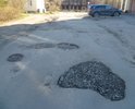 Многочисленные дефекты дорожного полотна улицы Грибоедова (от дома № 6"а" до пересечения с улицей Советская).