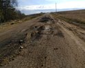 Дорога разбита в хлам. Грузовики сделали ее не проездной для легковушек.
