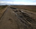 Дорога разбита в хлам. Грузовики сделали ее не проездной для легковушек.