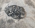 Заявление 
  
03.06.2018 мною на территории дороги по адресу: Республика Коми, г. Ухта, Бельгопское шоссе вбыли обнаружены множественные повреждения дорожного полотна, размеры которых превышают предельно допустимые значения в соответствии с требованиями ГОСТ Р 50597-93 «Автомобильные дороги и улицы. Требования к эксплуатационному состоянию, допустимому по условиям обеспечения безопасности дорожного движения». Данные повреждения представляют опасность для участников дорожного движения.
  	В пункте 1 ГОСТ Р 50597-93 указана его область применения. В эту область входят «все дороги и улицы городов и других населенных пунктов». При этом там же указано, что «категории улиц и дорог в городах и населенных пунктах определяются по СНиП 2.07.01.».
   	При этом в СНиП 2.07.01, в разделе 6, в таблице 7, указаны, среди прочих, следующие категории улиц и дорог в городах и населённых пунктах:
   	1. «Улицы в жилой застройке» - транспортная (без пропуска грузового и общественного транспорта) и пешеходная связи на территории жилых районов (микрорайонов), выходы на магистральные улицы и дороги регулируемого движения.
  	2. «Проезды» - подъезд транспортных средств к жилым и общественным зданиям, учреждениям, предприятиям и другим объектам городской застройки внутри районов, микрорайонов, кварталов.
  	Указанный в моём заявлении проезд во дворе дома 19а по ул.30 лет Октября предназначен для подъезда транспортных средств к жилому зданию, а следовательно, на него распространяются требования ГОСТ Р 50597-93.
  	В статье 36 Жилищного кодекса указано, что: «Границы и размер земельного участка, на котором расположен многоквартирный дом, определяются в соответствии с требованиями земельного законодательства и законодательства о градостроительной деятельности.»
  	Тогда как в пункте 12 статьи 85 Земельного кодекса указан прямой запрет на приватизацию земельных участков общего пользования, занятые площадями, улицами, проездами, автомобильными дорогами.
   	Согласно требованию статьи 6 Федерального Закона «Об автомобильных дорогах и дорожной деятельности», указанный мной участок дороги должен находится в собственности МОГО Ухта.
   	Статьей 1 ФЗ «О безопасности дорожного движения» в качестве задачи определена охрана жизни, здоровья и имущества граждан, защита их прав и законных интересов, общества и государства путем предупреждения дорожно-транспортных происшествий, снижения тяжести их последствий. Основные требования по обеспечению безопасности дорожного движения при содержании дорог определяются ст. 12 указанного закона, в соответствии с которой содержание дорог на территории РФ должно обеспечивать безопасность дорожного движения.
  	В соответствии с п.19 ч.1 ст.12 ФЗ «О полиции» на полицию возлагаются обязанность по осуществлению государственного контроля (надзора) за соблюдением правил, стандартов, технических норм и иных требований нормативных документов в области обеспечения безопасности дорожного движения. Максимальный срок, предусмотренный ГОСТ Р 50597-93 для исправления повреждений дорожного покрытия составляет 10 суток. В связи с изложенным, на основании п.11 Положения «О ГИБДД МВД РФ», ст. 12 ФЗ «О полиции», п.3 ч.1.ст. 28.1, ч.1 ст29.13 КоАП Российской Федерации прошу:
1)	Возбудить дело об административном правонарушении по статье 12.34 КоАП РФ «Несоблюдение требований по обеспечению безопасности дорожного движения при ремонте и содержании дорог, железнодорожных переездов или других дорожных сооружений» в отношении дорожной службы, ответственной за содержание и ремонт указанного дорожного участка.
2)	Выдать предписание о принятии мер по устранению указанных недостатков.
3)	По существу моего заявления и о принятых мерах сообщить мне письменно.