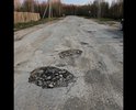 Заявление 
  
03.06.2018 мною на территории дороги по адресу: Республика Коми, г. Ухта, Бельгопское шоссе вбыли обнаружены множественные повреждения дорожного полотна, размеры которых превышают предельно допустимые значения в соответствии с требованиями ГОСТ Р 50597-93 «Автомобильные дороги и улицы. Требования к эксплуатационному состоянию, допустимому по условиям обеспечения безопасности дорожного движения». Данные повреждения представляют опасность для участников дорожного движения.
  	В пункте 1 ГОСТ Р 50597-93 указана его область применения. В эту область входят «все дороги и улицы городов и других населенных пунктов». При этом там же указано, что «категории улиц и дорог в городах и населенных пунктах определяются по СНиП 2.07.01.».
   	При этом в СНиП 2.07.01, в разделе 6, в таблице 7, указаны, среди прочих, следующие категории улиц и дорог в городах и населённых пунктах:
   	1. «Улицы в жилой застройке» - транспортная (без пропуска грузового и общественного транспорта) и пешеходная связи на территории жилых районов (микрорайонов), выходы на магистральные улицы и дороги регулируемого движения.
  	2. «Проезды» - подъезд транспортных средств к жилым и общественным зданиям, учреждениям, предприятиям и другим объектам городской застройки внутри районов, микрорайонов, кварталов.
  	Указанный в моём заявлении проезд во дворе дома 19а по ул.30 лет Октября предназначен для подъезда транспортных средств к жилому зданию, а следовательно, на него распространяются требования ГОСТ Р 50597-93.
  	В статье 36 Жилищного кодекса указано, что: «Границы и размер земельного участка, на котором расположен многоквартирный дом, определяются в соответствии с требованиями земельного законодательства и законодательства о градостроительной деятельности.»
  	Тогда как в пункте 12 статьи 85 Земельного кодекса указан прямой запрет на приватизацию земельных участков общего пользования, занятые площадями, улицами, проездами, автомобильными дорогами.
   	Согласно требованию статьи 6 Федерального Закона «Об автомобильных дорогах и дорожной деятельности», указанный мной участок дороги должен находится в собственности МОГО Ухта.
   	Статьей 1 ФЗ «О безопасности дорожного движения» в качестве задачи определена охрана жизни, здоровья и имущества граждан, защита их прав и законных интересов, общества и государства путем предупреждения дорожно-транспортных происшествий, снижения тяжести их последствий. Основные требования по обеспечению безопасности дорожного движения при содержании дорог определяются ст. 12 указанного закона, в соответствии с которой содержание дорог на территории РФ должно обеспечивать безопасность дорожного движения.
  	В соответствии с п.19 ч.1 ст.12 ФЗ «О полиции» на полицию возлагаются обязанность по осуществлению государственного контроля (надзора) за соблюдением правил, стандартов, технических норм и иных требований нормативных документов в области обеспечения безопасности дорожного движения. Максимальный срок, предусмотренный ГОСТ Р 50597-93 для исправления повреждений дорожного покрытия составляет 10 суток. В связи с изложенным, на основании п.11 Положения «О ГИБДД МВД РФ», ст. 12 ФЗ «О полиции», п.3 ч.1.ст. 28.1, ч.1 ст29.13 КоАП Российской Федерации прошу:
1)	Возбудить дело об административном правонарушении по статье 12.34 КоАП РФ «Несоблюдение требований по обеспечению безопасности дорожного движения при ремонте и содержании дорог, железнодорожных переездов или других дорожных сооружений» в отношении дорожной службы, ответственной за содержание и ремонт указанного дорожного участка.
2)	Выдать предписание о принятии мер по устранению указанных недостатков.
3)	По существу моего заявления и о принятых мерах сообщить мне письменно.