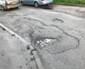 Добрый день. Вокруг многоквартирных домов №№ 17, 19 образовались ямы в количестве 67 штук. Некоторые ямы достигаю в глубину 15-20 см, а размеры от 1,5 до 2 метров. Проблема существует более трех лет. Мне постоянно присылают отписки, а результата как не было так и нет. При таких параметрах ям это капитальный ремонт дороги.