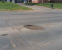Капитально эта улица не ремонтировалась очень давно. Сейчас она выглядит как куча заплаток одна на другой. Каждую весну появляются новые дыры, а за ними и новые заплатки. Эта дорога является частью федеральной трассы А 331. По ней в день передвигается огромное количество как легковых машин, так и большегрузов, и несмотря на это, капитального ремонта она не видела очень много лет. Местами видны уже плиты, которые лежат под тонким слоем старого асфальта. помогите, пожалуйста, нам с ремонтом этой улицы...