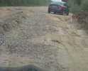 Автомобильная дорога, проходящая вдоль железной дороги от ж/д ст.Михайловская до подъезда к д.Славянка находится в ужасном состоянии. Эта дорога включена в перечень автомобильных дорог общего пользования Кировского муниципального района Ленинградской области в 2014 году. У Кировского района нет фактически средств на достойное содержание дороги.По этой дороге ежедневно ездят садоводы 18 СНТ и д.Славянка. Силами садоводов проводится грейдеровка и подсыпка щебнем, но это ничтожно мало и хватает до первого дождя. От лица всех садоводов просим помочь в ремонте этой дороги.