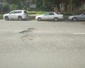 Глубокие ямы на проезжей части. Заторы, т.к. водителям приходтся перестраиваться, что бы не угодить в ямы