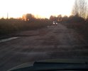 Дорога в ужасном состоянии. Ямы. После дождя огромные лужы. Что самое интересное эта дорога ведет к местному асфальтному заводу.