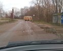 Огромные ямы. Лужи. Асфальт местами погребен под слоем грязь. К автобусной остановке не подойти. Выезд на улицу Транспортную из-за огромной и глубоко ямы на повороте возможен только со встречного направления.
