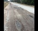 К сожалению, уже несколько лет мне приходится регулярно ездить на работу по Рощинскому ш. (Магистральная/Бетонка).  Между пос. Огоньки и пос. Решетниково эта автодорога находится в ужасном состоянии: напоминает ни то что шоссе, а уже вообще не соответствует никаким требованиям к дорогам общего назначения. Глубина ям достигает 15 сантиметров; зимой дорога плохо убирается и возникают во льду заполненные водой колодцы глубиной в 20-25 см. По такой дороге проехать может не каждый водитель и не каждый автомобиль. 

При этом, на объект, на котором я работаю, находящийся как раз на этой дороге, приезжают школьники группами по 40 человек на автобусах, проводятся крупные мероприятия до 1000 человек. Наличие такой проблемы с дорогой просто небезопасно, и, мне кажется, это - прямое упущение со стороны органов власти. Т. к. рядом дороги все отремонтировали летом-2018, а эта только хуже с каждым годом.

Прошу Вас провести инспекцию дорожного полотна на данном «шоссе» и устранить ямы. Ехать по этой дороге со скоростью больше 10 км/ч практически невозможно - автобусы и машины сотрудников, окружающих дачников и отдыхающих постоянно с проколотыми шинами, да и просто страшно тут ездить.
Прошу принять меры к восстановлению дорожного полотна!