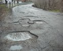 Эта дорога не ремонтируется уже несколько лет. При том, что по этой дороге проходит автобусный маршрут Феодосия-Урочище. Дорожное полотно разбито на 80%. Глубина колдобин достигает 30 см. Создается прямая угроза жизни и здоровью пассажиров. Дети ездят в школу. А ведь дорога проходит в горной местности. Наверное ждут повторения трагедии, которая случилась совсем рядом. Ждут новых смертей?