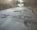 Эта дорога не ремонтируется уже несколько лет. При том, что по этой дороге проходит автобусный маршрут Феодосия-Урочище. Дорожное полотно разбито на 80%. Глубина колдобин достигает 30 см. Создается прямая угроза жизни и здоровью пассажиров. Дети ездят в школу. А ведь дорога проходит в горной местности. Наверное ждут повторения трагедии, которая случилась совсем рядом. Ждут новых смертей?