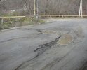 Эта дорога не ремонтируется уже несколько лет. При том, что по этой дороге проходит автобусный маршрут Феодосия-Урочище. Дорожное полотно разбито на 80%. Глубина колдобин достигает 30 см. Создается прямая угроза жизни и здоровью пассажиров. Дети ездят в школу. А ведь дорога проходит в горной местности. Наверное ждут повторения трагедии, которая случилась совсем рядом. Ждут новых смертей?