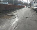 Огромные ямы поперёк всей ширины проезжей части. Между платной парковкой и домом Авиагородок 18.