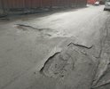 Огромные ямы поперёк всей ширины проезжей части. Между платной парковкой и домом Авиагородок 18.