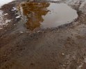 Асфальт в селе положили в начале 90-х годов прошлого века и больше об этой дороге никто не вспоминал. Дорога расположена в селе Устье Тотемского района Вологодской области. А в самом селе находится знаменитейший на всю область храм - Покрова Пресвятой Богородицы. Знаменит он тем, что не закрывался никогда. В самом храме имеется уникальный иконостас конца ХV111 века и два мраморных иконостаса в двух церковных пределах. В связи с чем, село (официально почему-то - деревня) посещается и паломниками и туристами. О дорожной проблеме можно сказать ещё больше - к селу ведет грунтовая дорога, длиной 18 километров. Это не дорога - это большая катастрофа.