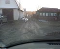 Очень узкий въезд на ул. Тихая. Покрытия нет, довольно легко можно застрять и не выехать с данной улицы.