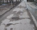 Необходим ямочный ремонт всей улицы Мартеновская. На фото приведены лишь отдельные участки.