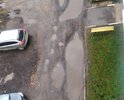 По адресу г.Новомосковск ул. Мира 9а проезд у многоквартирного жилого дома имеет множественные повреждения дорожного полотна, размеры повреждений явно превышают предельно допустимые значения в соответствии с требованиями ГОСТ Р 50597-93 "Автомобильные дороги ...". Данные повреждения после выпадения даже кратковременных осадков мгновенно заполняются водой, что делает невозможным проход пешеходов по указанному проезду к своим подъездам, т.к. многие повреждения занимают всю ширину этого проезда. Произведенная летом 2017 года частичная подсыпка повреждений неустановленным материалом (был похож на смесь грязи и шлака) только усугубила ситуацию, добавив к повреждениям полотна еще и грязь. Просьба произвести надлежащий ремонт проезда у дома по адресу Мира 9а и сообщить сроки его проведения.